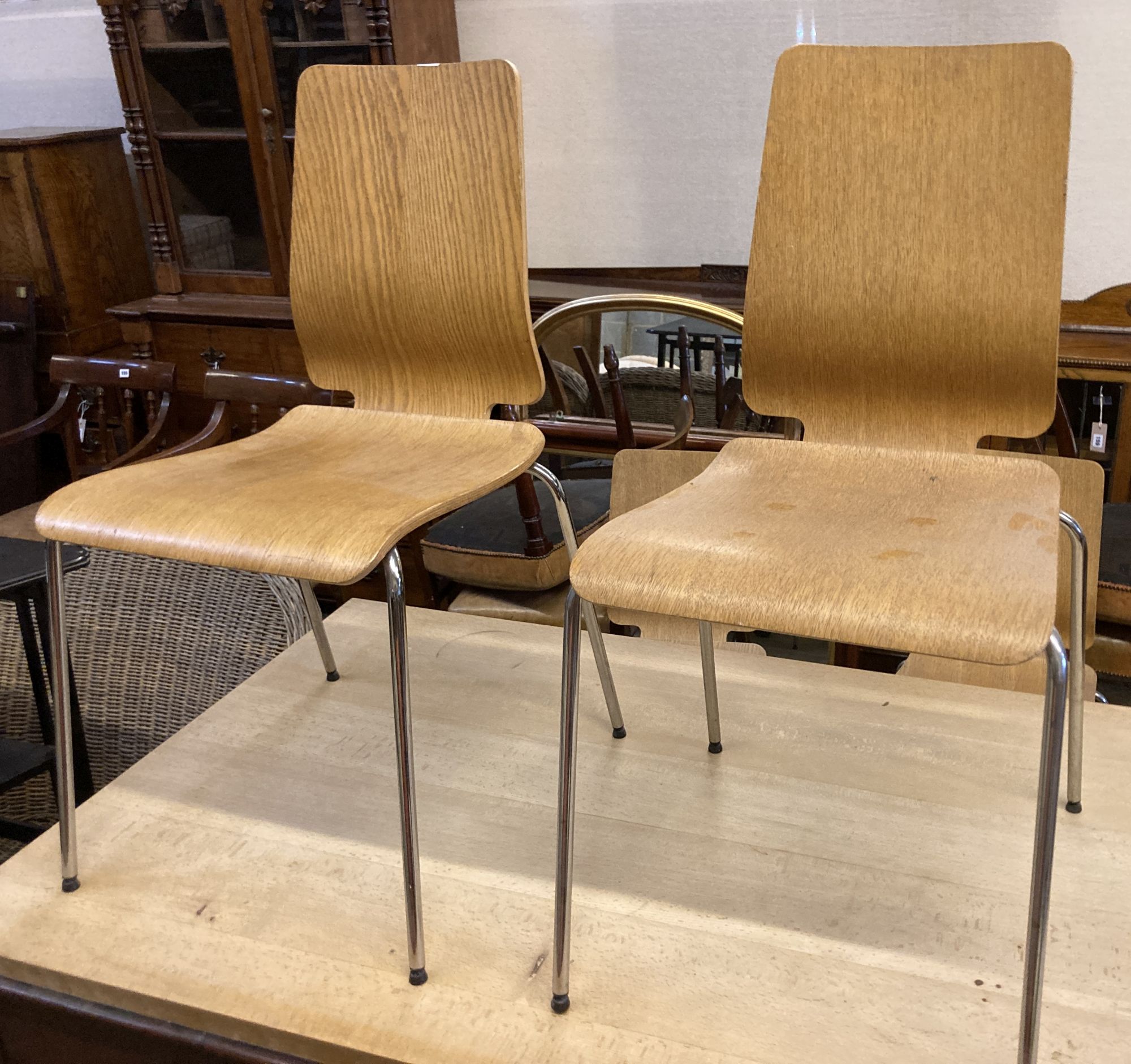 A set of four mid century design bentwood and chrome dining chairs